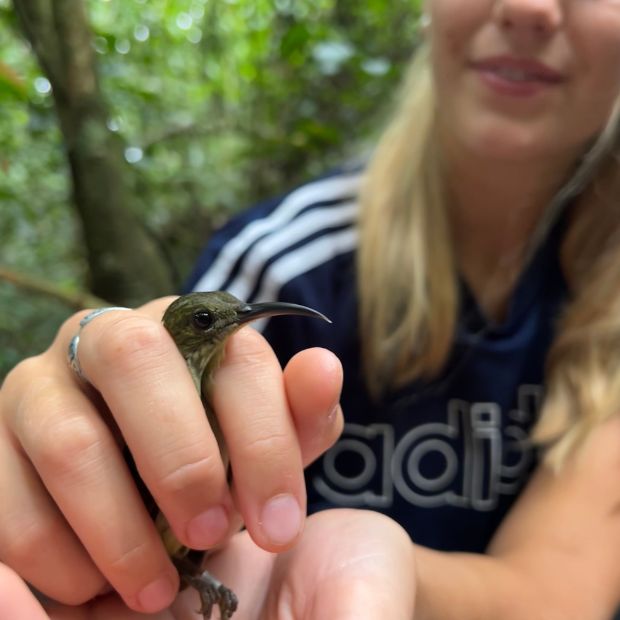 Tilly holding a bird