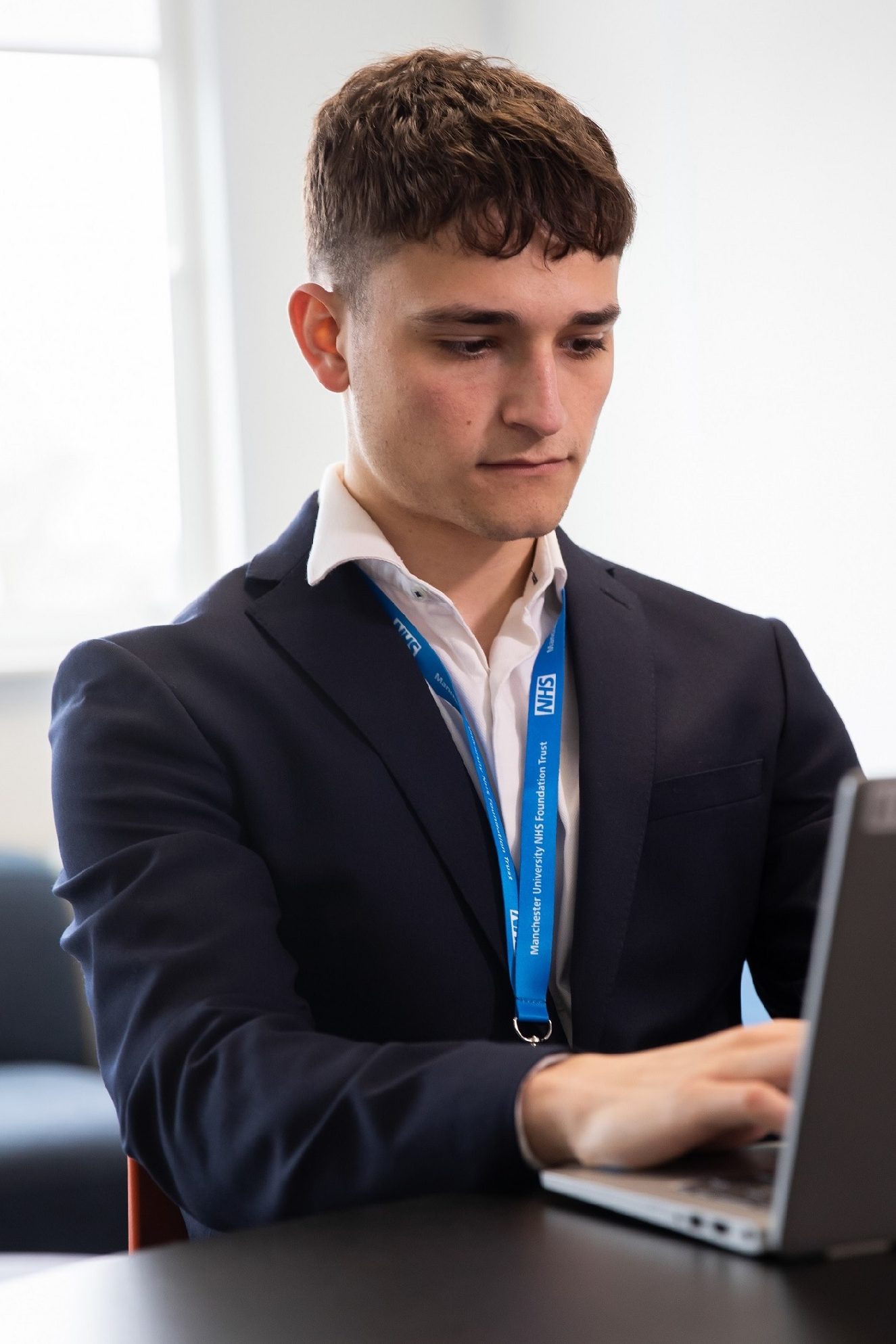 Photo of Harry Rosenburg at a laptop