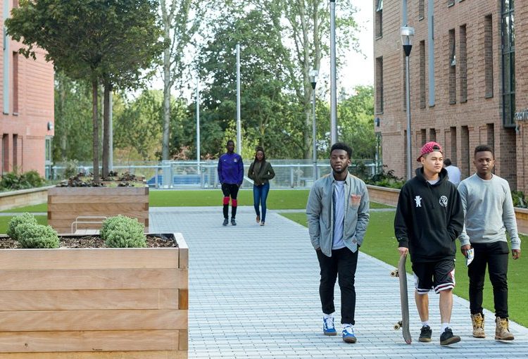 Students leaving Peel Park Quarter accommodation