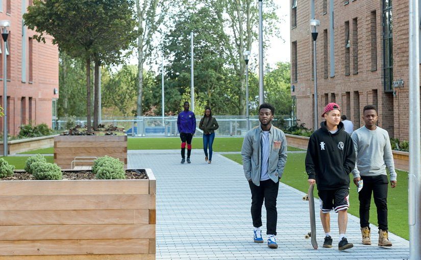 Students leaving Peel Park Quarter accommodation