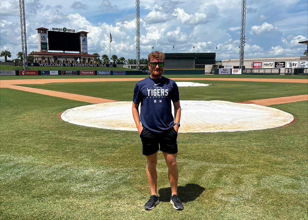 Sport Rehabilitation student Jack stood on the turf at Joker Marchant Stadium